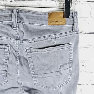 AMERICAN EAGLE | Hi-Rise Jegging exposed button fly skinny stretch jeans